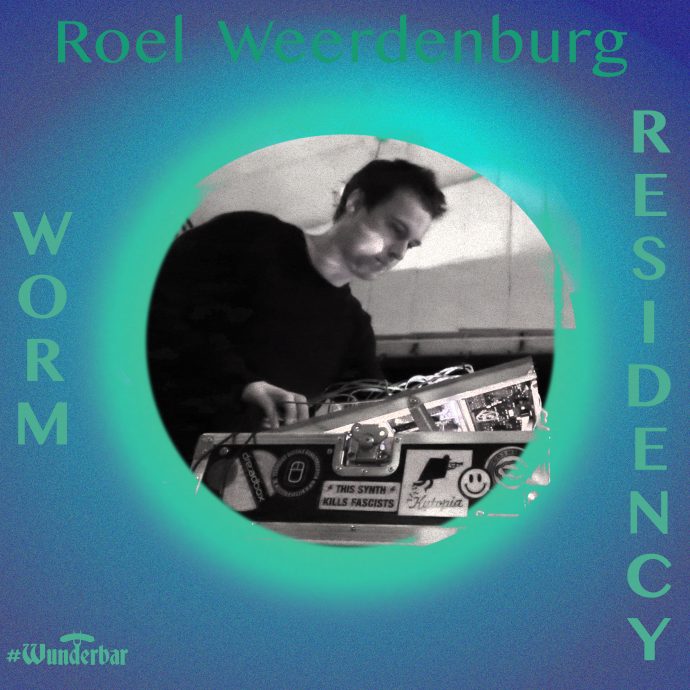 A black and white photograph of quantum mechanic Roel Weerdenburg playing, or engaging with an electronic apparatus. The photograph is set in a circle. Around the circle is a turquoise and blue background, the Wunderbar logo bottom left, the artist's name and the words WORM RESIDENCY also in the circle. Image promoting the WunderPlatz x SKILLS project, The Foyer, 2020: