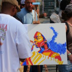 Colour photo by WORM club programmer Frederik Teixeira showing a street scene of partying and creative people during the block party for the Farroffa x WORM event July 2026