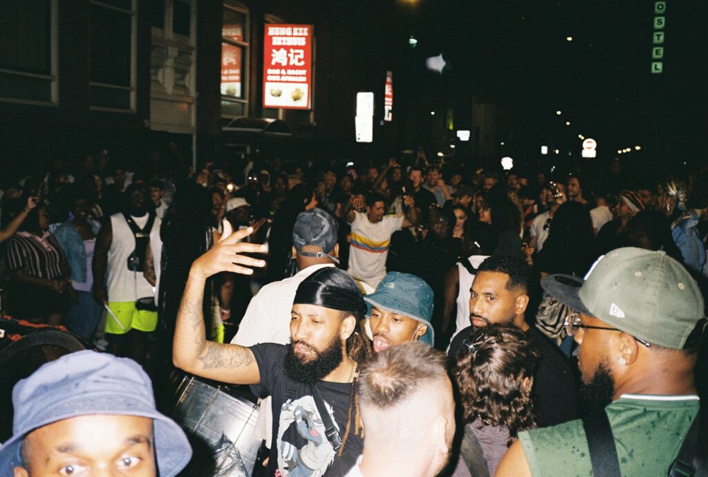 CColour photo by WORM club programmer Frederik Teixeira showing a club scene of partying people on the Boomgaardsstraat during the first edition of Roots and Riddims July 2025