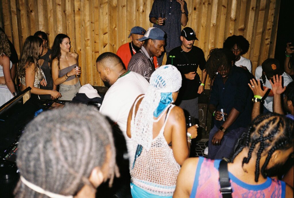 Colour photo by WORM club programmer Frederik Teixeira showing a club scene of partying people during the first edition of Roots and Riddims July 2025