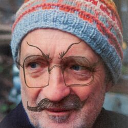 Colour photo of a colour scan of Lukas Simonis wearing a bobble hat. The photo has been scribbled on