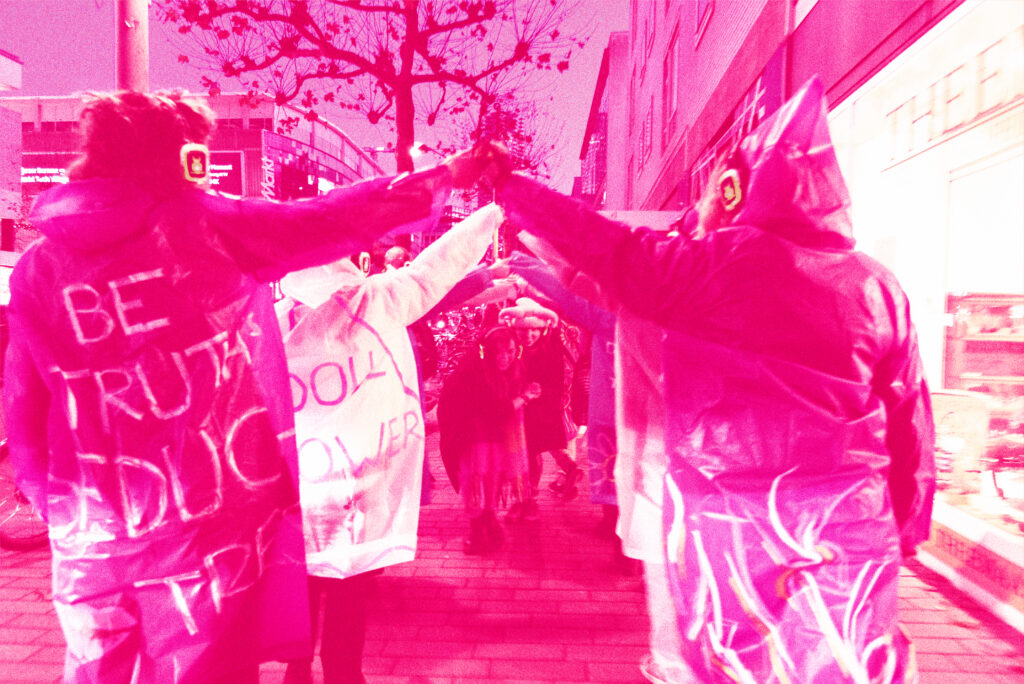 Treated photograph in pink of a line of people, backs to the camera, giving high fives